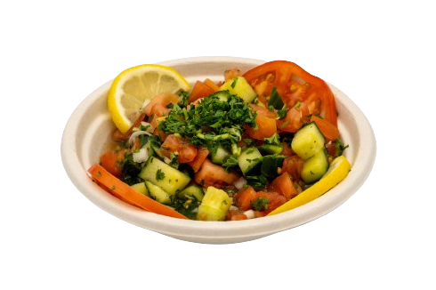 A bowl of salad with lemon and parsley.